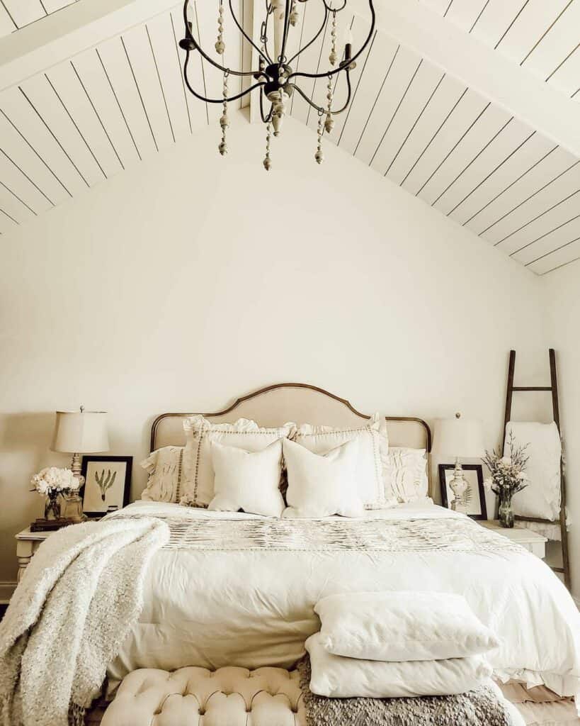 Cozy White Bed Against an A-frame Wall