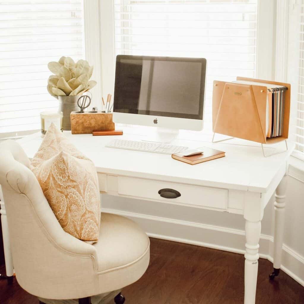 Cream Desk Chair Tucked Beneath White Desk