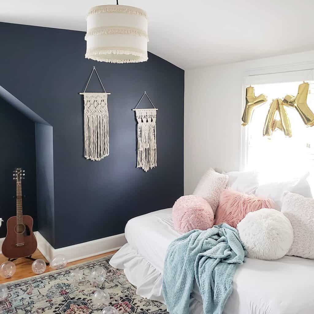 Deep Blue Accent Wall With Macramé Wall Hangings