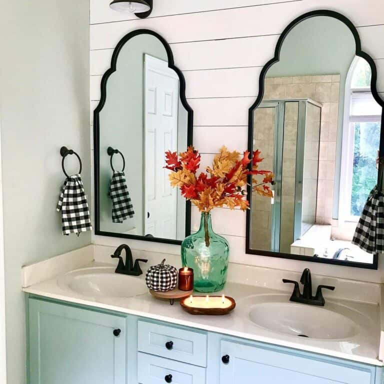 Eccentric Arched Mirror Above Light Blue Vanity