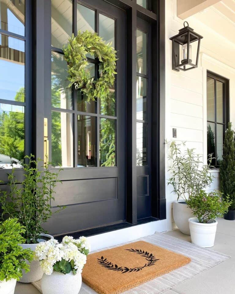 Elegant Black Door With Greenery Décor