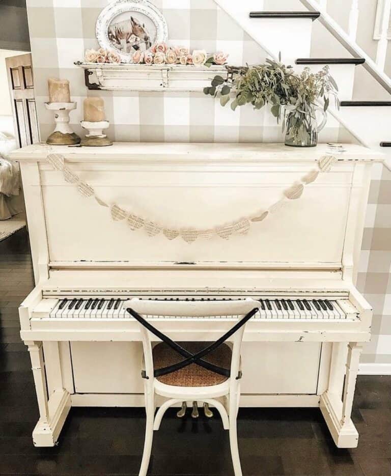 Elegant White Piano With Earth-toned Checkered Wallpaper