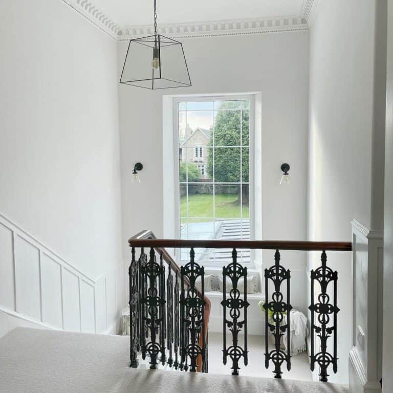Elegant White Staircase With Contemporary Black Lantern Chandelier