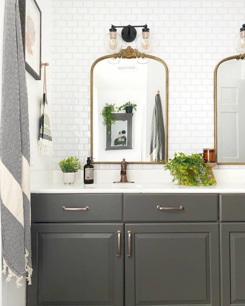 Embellished Arched Mirrors on White Tile Backsplash