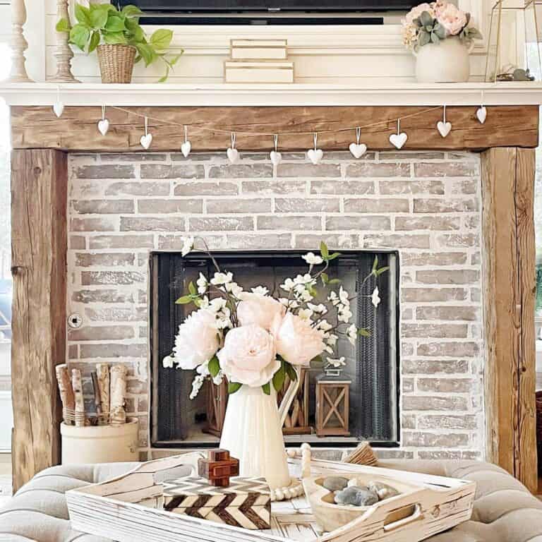 Empty Brick Fireplace With Wood Lanterns