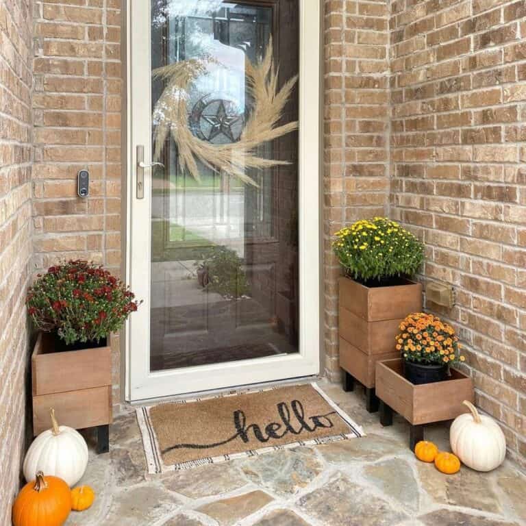 Entrance Front Door Décor Ideas With Flowers in Wood Planters