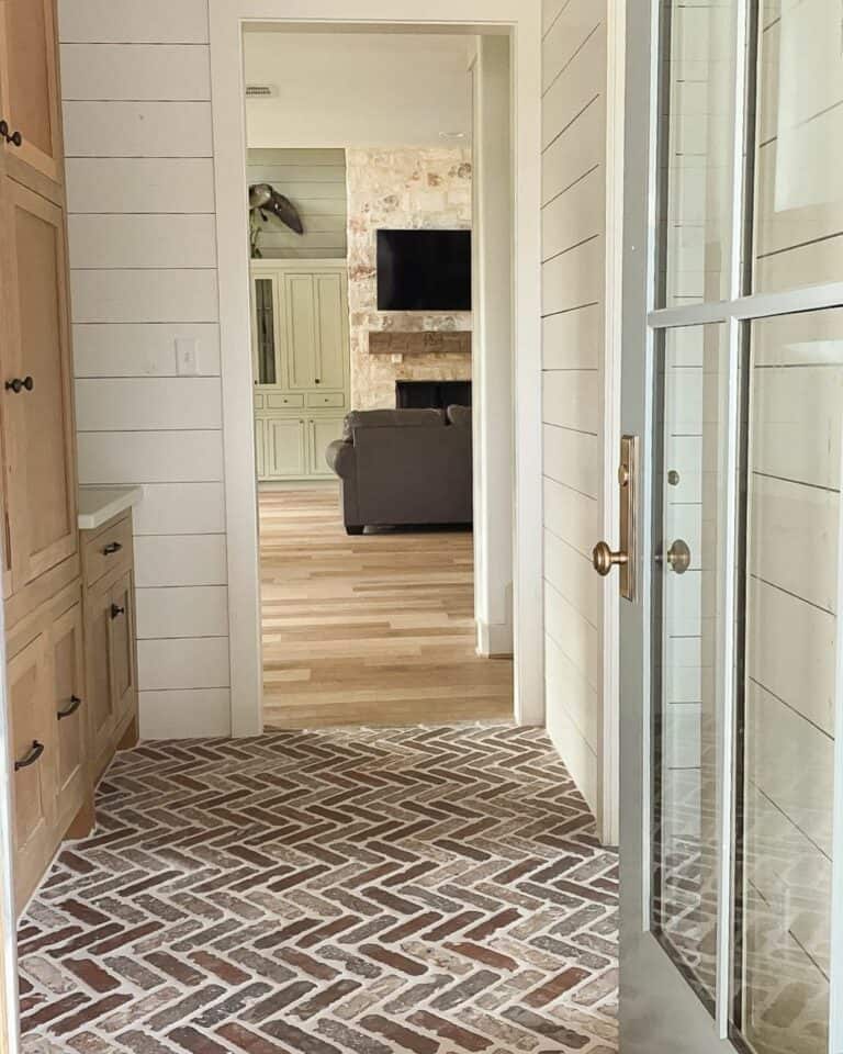Entryway With Shiplap Leading To Living Room