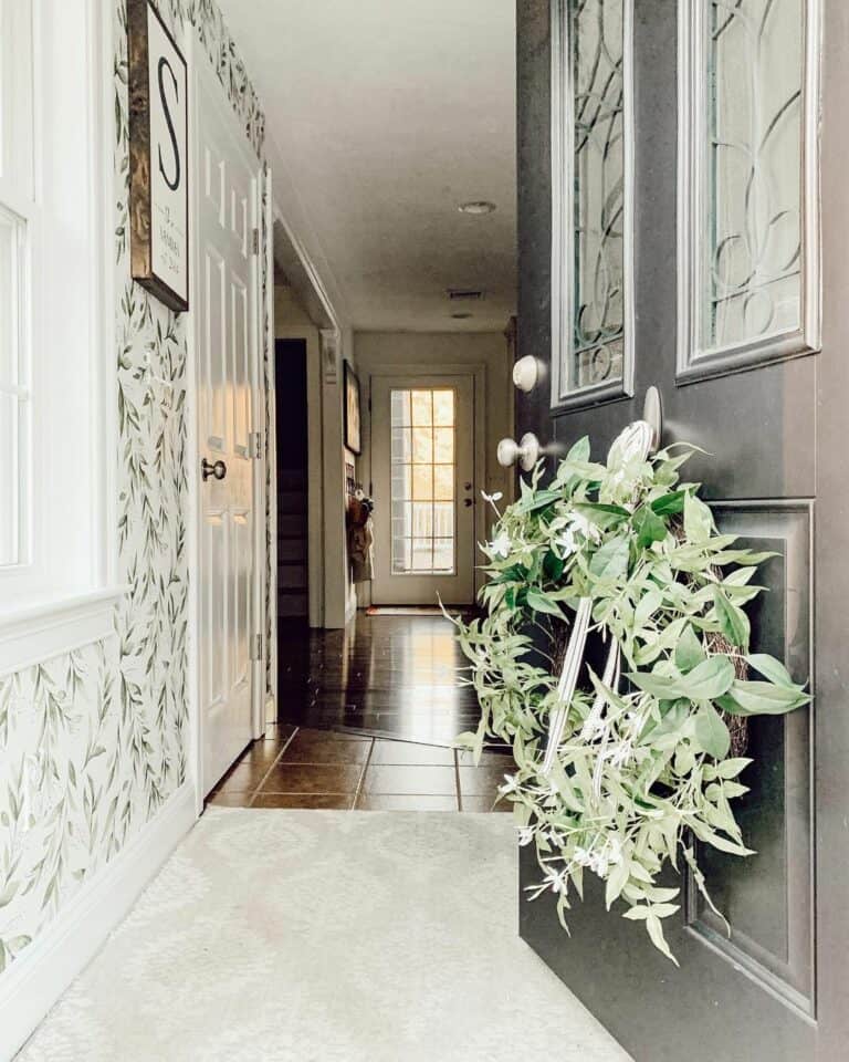Entryway With Wreaths and Leaf-patterned Wallpaper