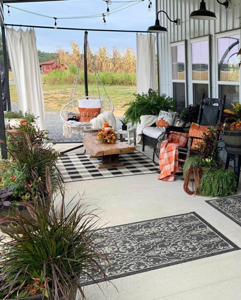Fall Décor on Concrete Patio With Black and White Rugs