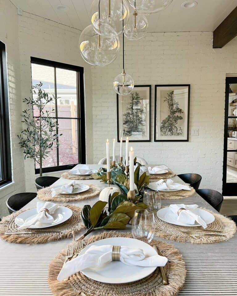Farmhouse Dining Room With White Brick Walls