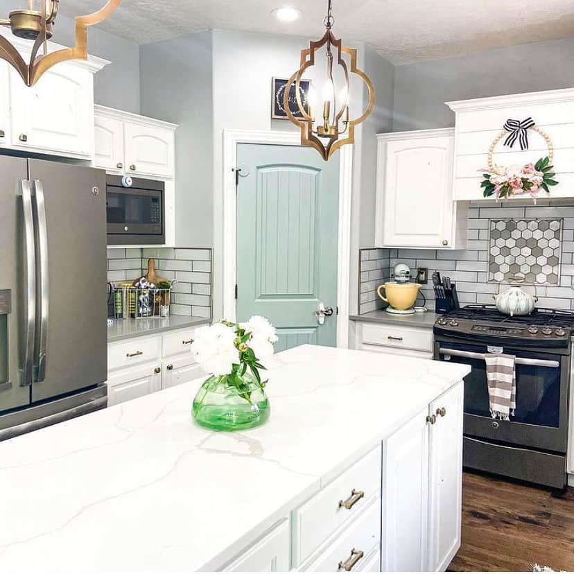 Farmhouse Kitchen With Light Green Pantry Door