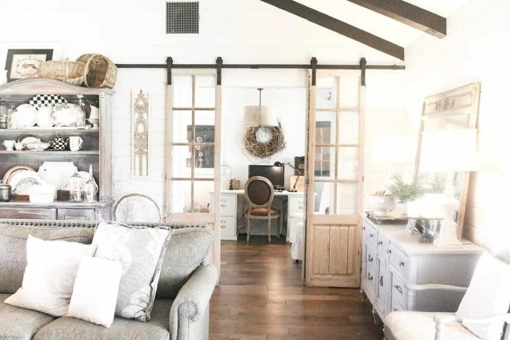 Farmhouse Living Room With Light Wood Glass Barn Doors