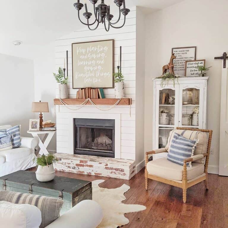 Farmhouse Living Room With a White Fireplace