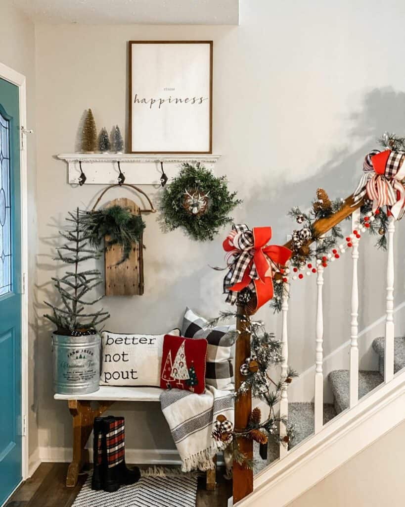 Festive Entryway With Teal Farmhouse Door