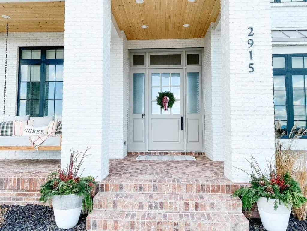 Festive Farmhouse Porch With Swing