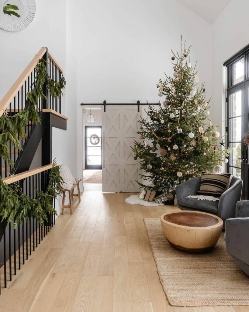 Festive Living Room With Black-accented Staircase
