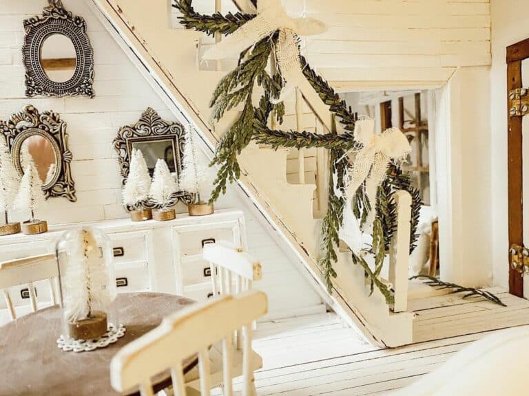 Festive White Farmhouse With Decorated Stairs