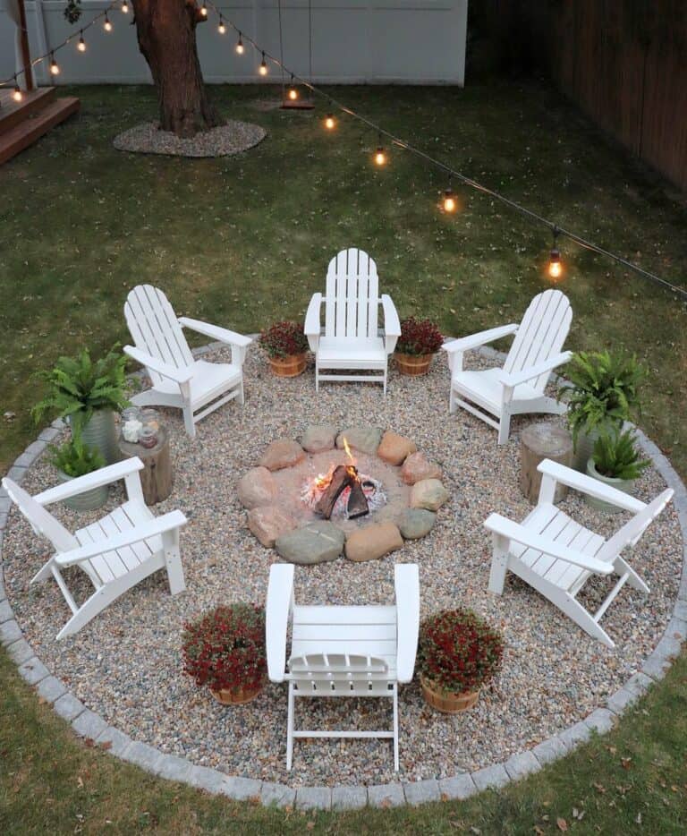 Firepit With White Chairs and String Lights