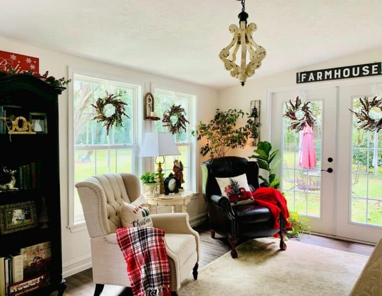 French Farmhouse Living Room With Wreaths on Windows