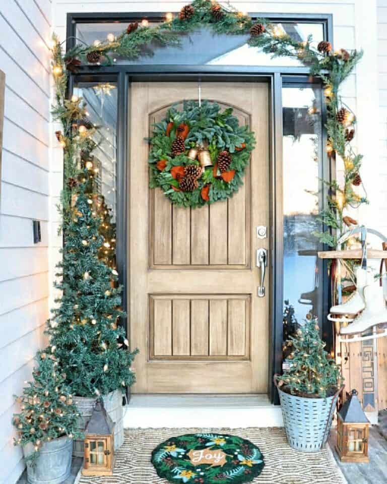 Front Porch With Small Christmas Trees in Metal Buckets Soul & Lane