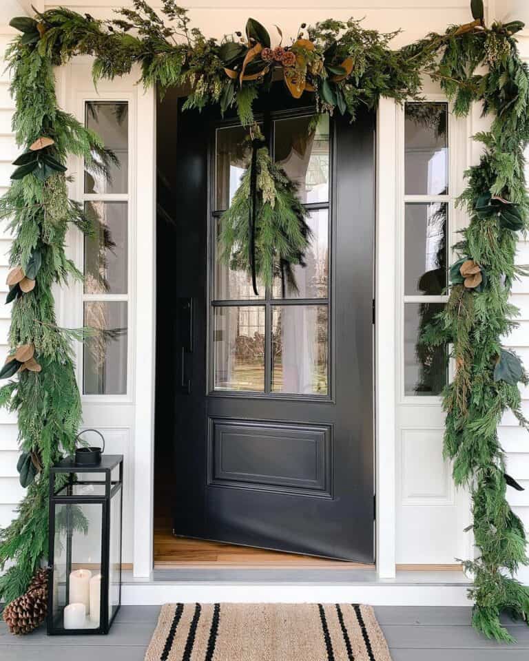 Garland Over Black Front Door With Side Lights