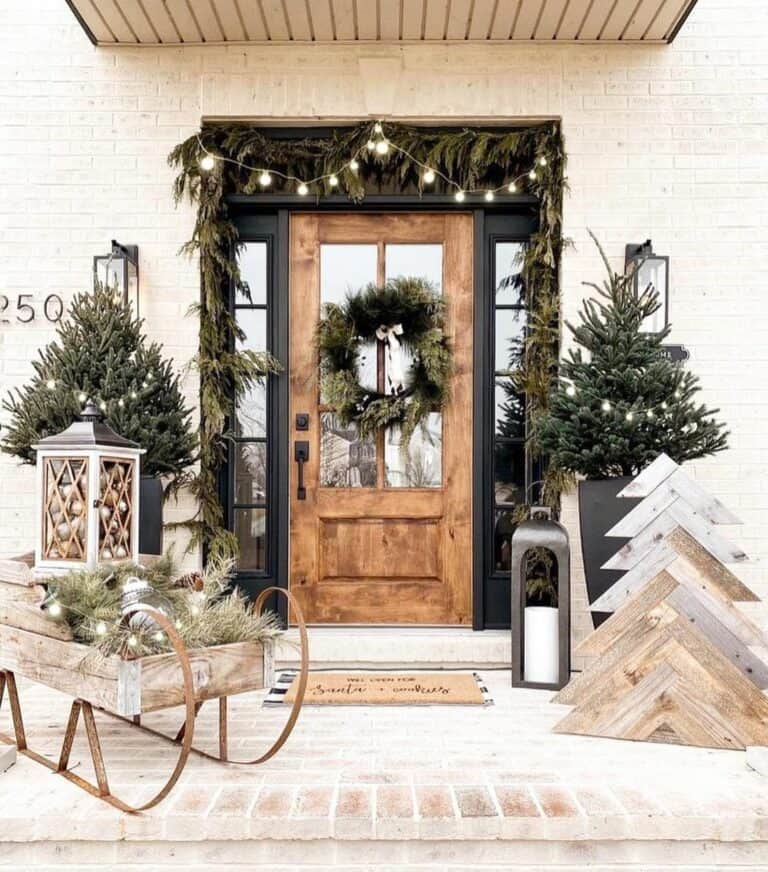 Garland of Greens and Lights as Front Door Decor