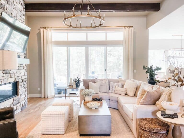 Gold Wagon Wheel Chandelier and Long White Curtains