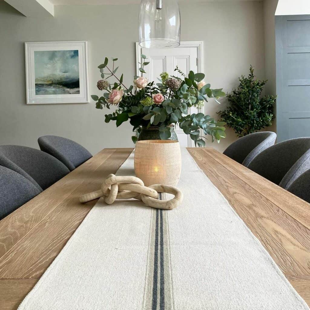 Gray Barrel Chairs Surround Wooden Table