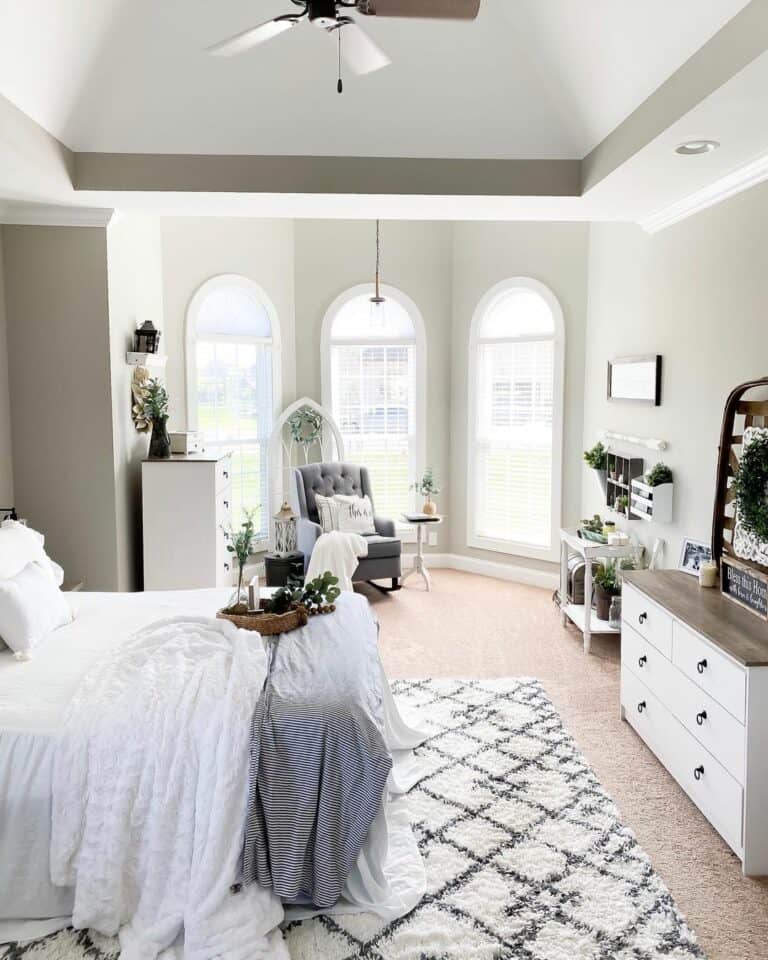 Gray and White Bedroom With Arched Windows