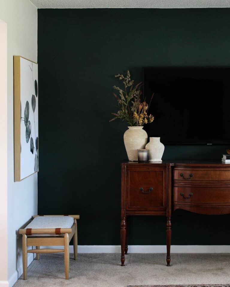 Green Accent Wall With Wooden Table