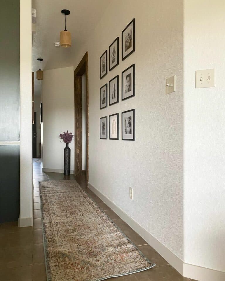 Hallway With Black-framed Photographs