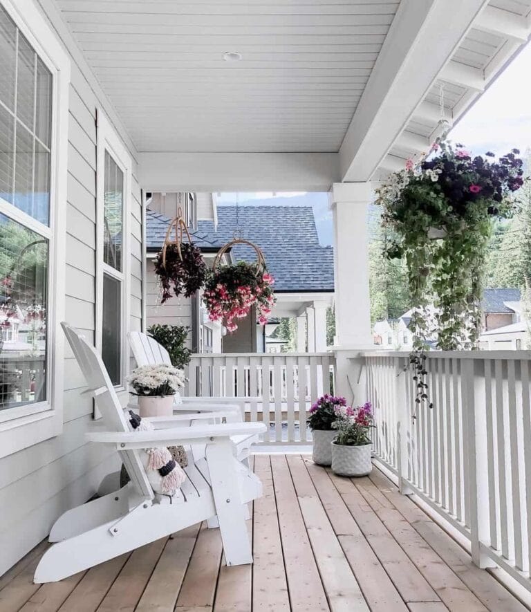 Hanging Plants on a White Porch