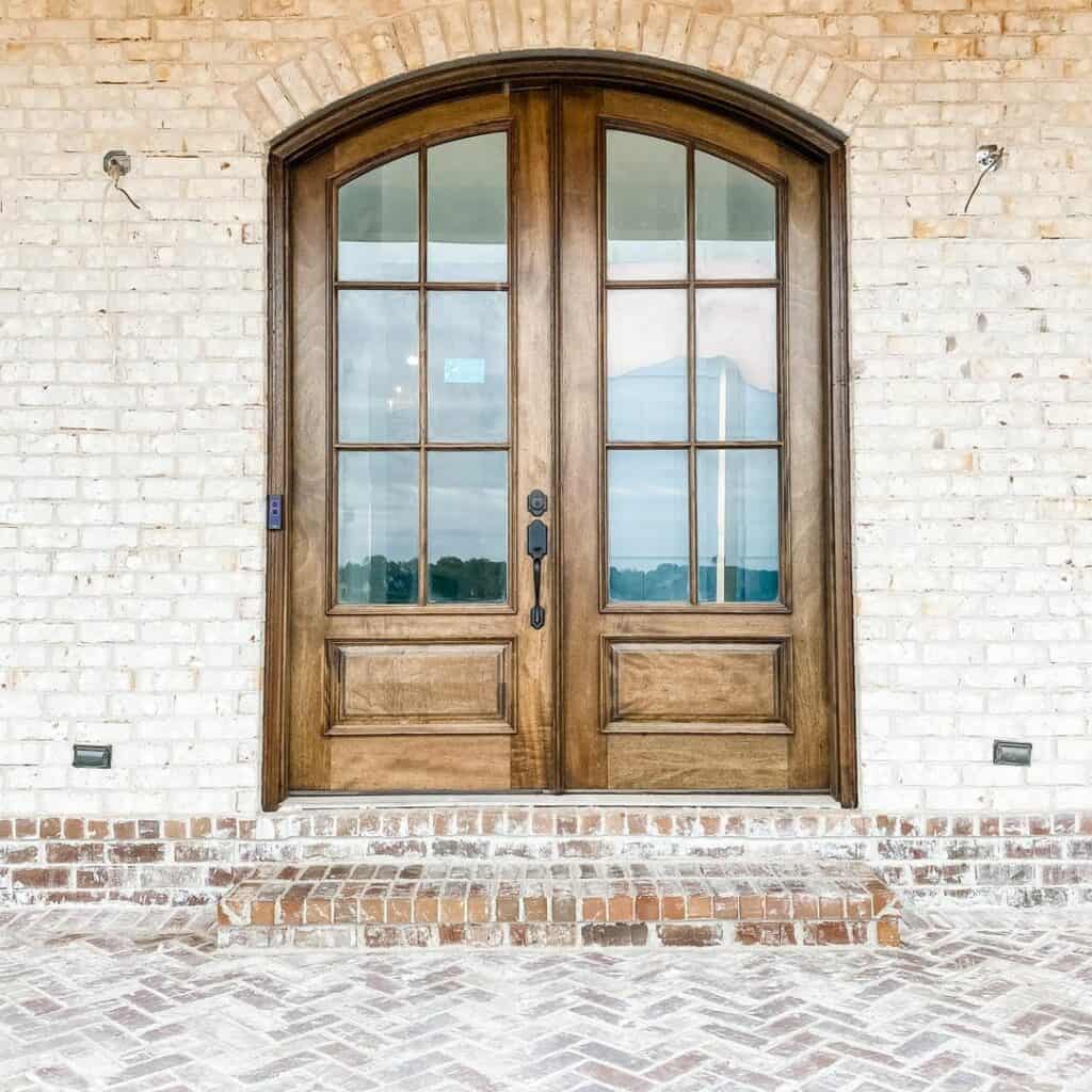 Herringbone Brick Steps With Arched Door