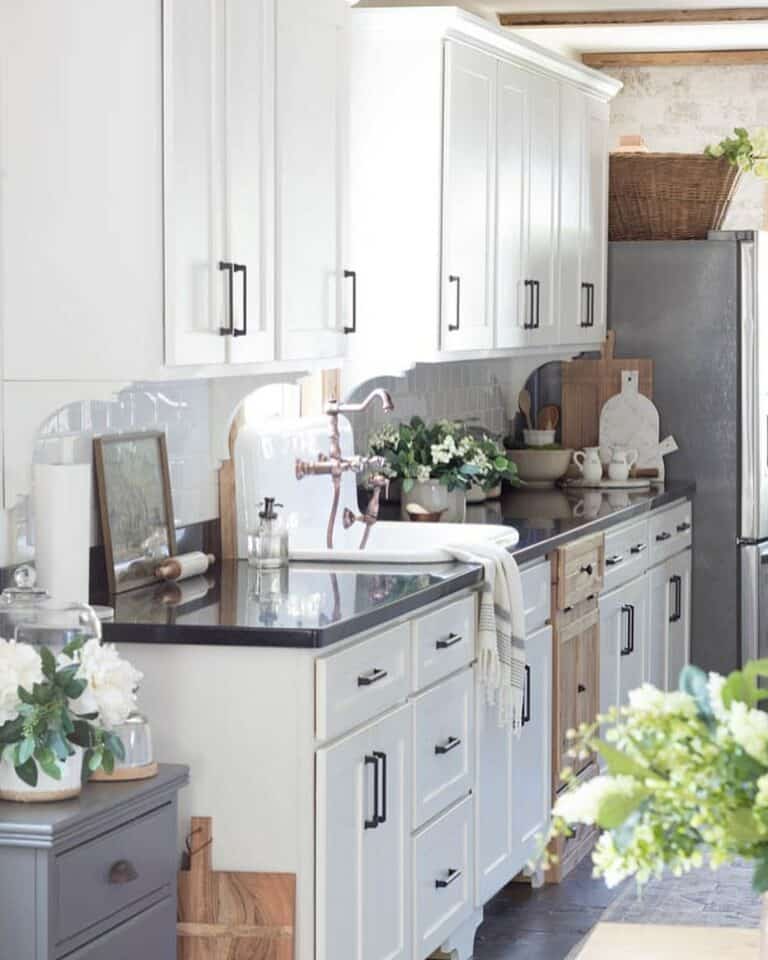 High-back Sink Surrounded by Black Countertops