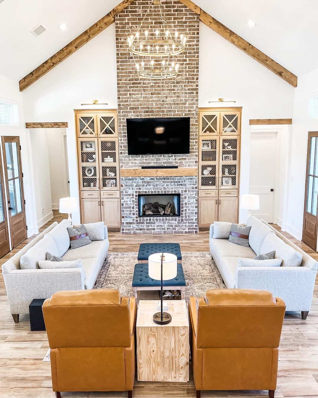 High-ceiling Living Room With and Stone Fireplace - Soul & Lane