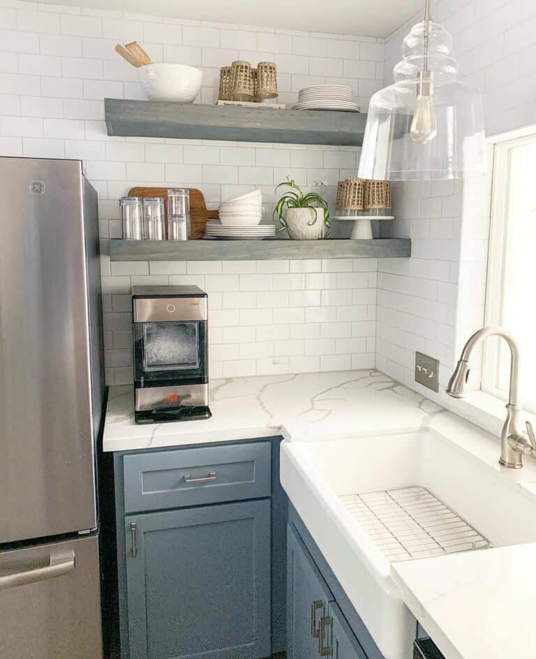 Kitchen With Blue Cabinets and Gray Open Shelves