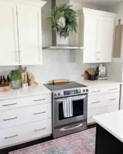 Kitchen With Gray Herringbone Tile Backsplash