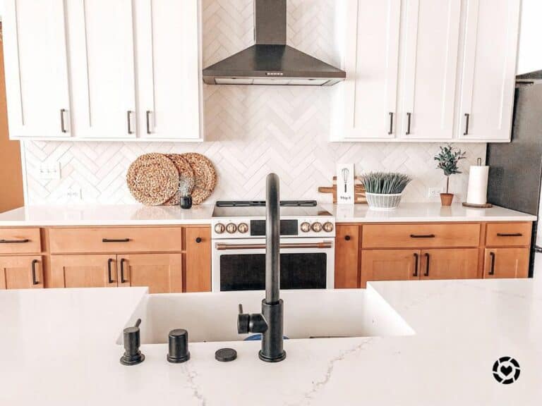 Kitchen With Gray Herringbone Tile Backsplash