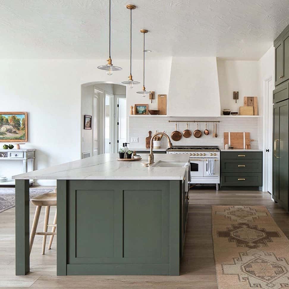 Kitchen With Massive Green Island Table - Soul & Lane