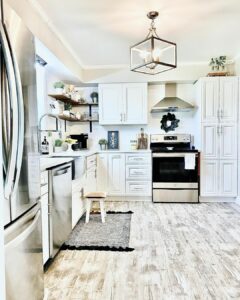 Kitchen With White Cabinets and Wood Floating Corner Shelves