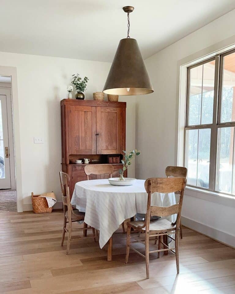 Large Bronze Pendant Light Over Rustic Table