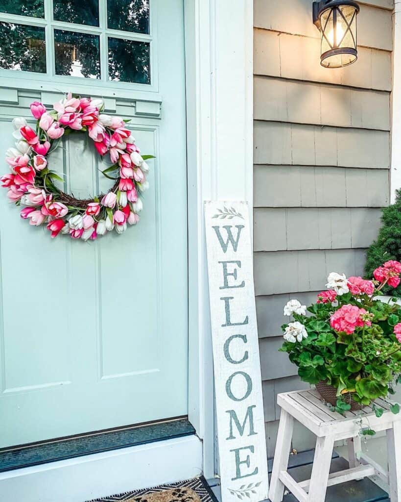 Light Blue Door With Pink Floral Wreath