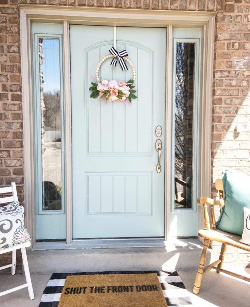 Light Blue Front Door With Pink Flower Wreath