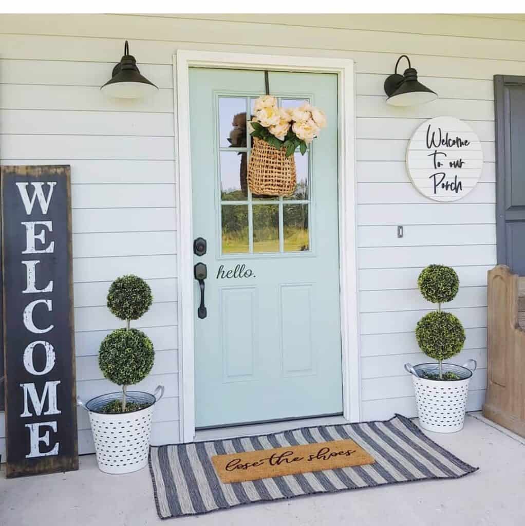 Light Blue Front Door With Yellow Floral Basket Décor