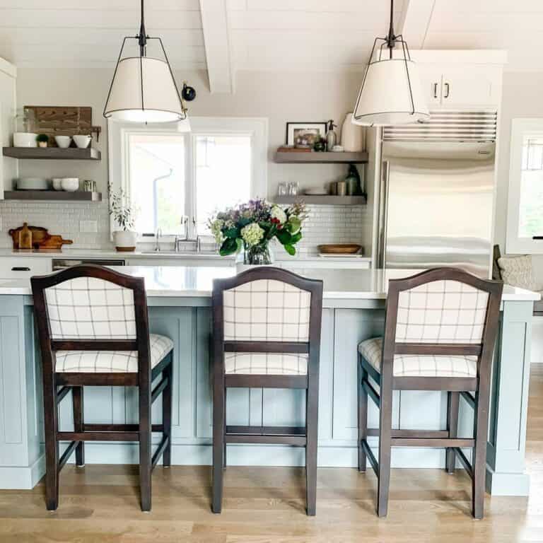 Light Blue Kitchen Island With Dark Stained Wood Chairs