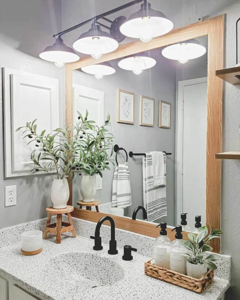 Light Gray Bathroom With Black Vanity Lighting