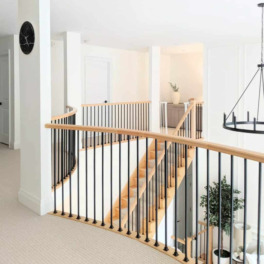 Light Wood Modern Farmhouse Staircase With Wagon Wheel Chandelier