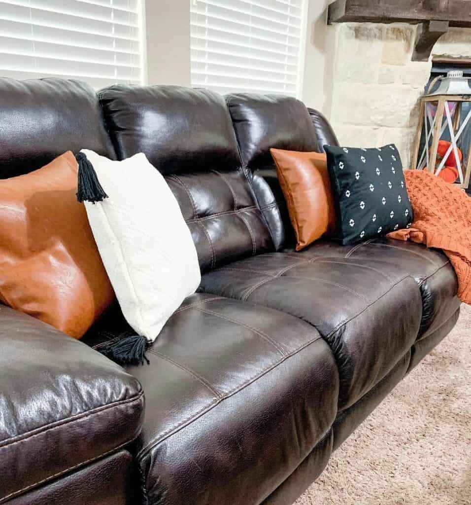 Living Room With Comfortable Dark Brown Leather Couch