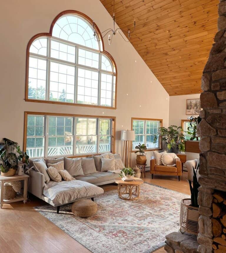 Living Room With Massive Wooden-framed Arched Windows