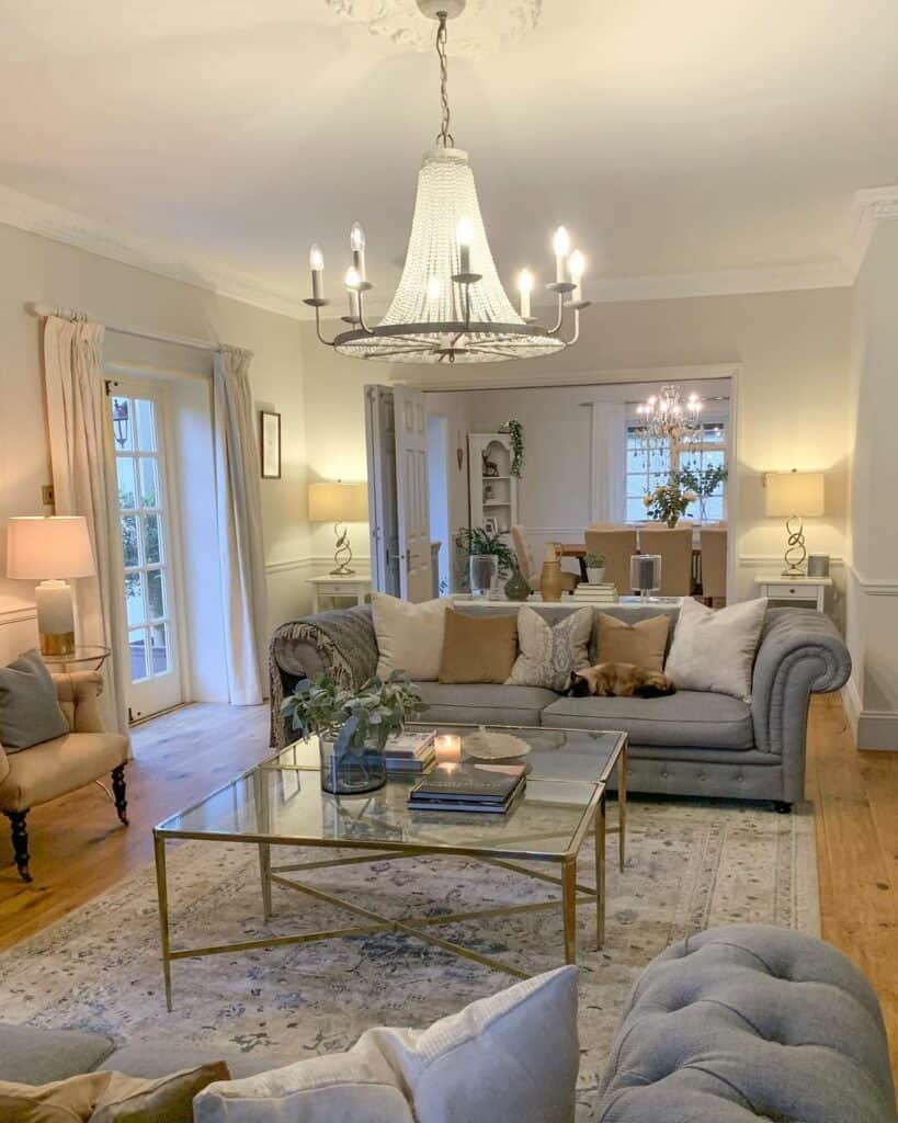 Low Ceiling Living Room With Gray and Crystal Chandelier